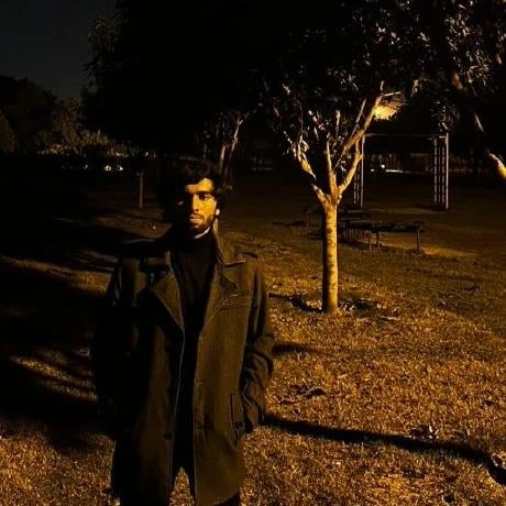Ali Ahmed standing in a park at night